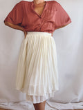 Falda plisada crema